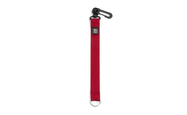 An 8-inch Iberian (red) Key Strap with a snaphook at one end and a split-ring o-ring at the other.